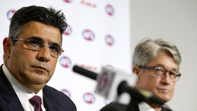 Former AFL chief executive Andrew Demetriou, pictured with former chairman Mike Fitzpatrick, hold a press conference about Essendon in 2013.