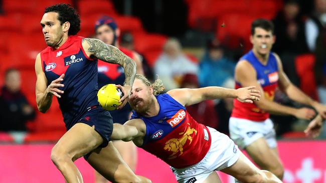 Melbourne’s Harley Bennell takes on the Lions at Metricon Stadium