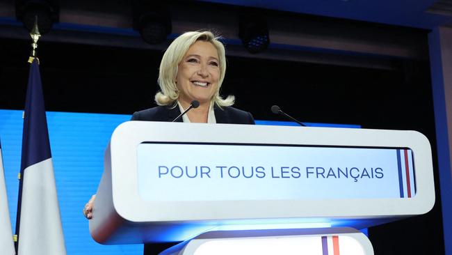 French far-right presidential candidate Marine Le Pen smiles after delivering a speech at the Pavillon d'Armenonville in Paris on April 24, 2022 following the announcement of the first projections by polling firms of the French presidential election's second round results.