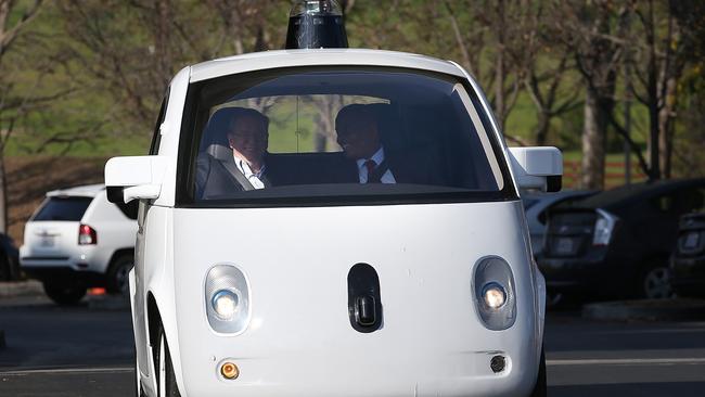 Autonomous cars ... US Transportation Secretary Anthony Foxx (R) and Google Chairman Eric Schmidt as they ride in a Google self-driving car at the Google headquarters in Mountain View, California.