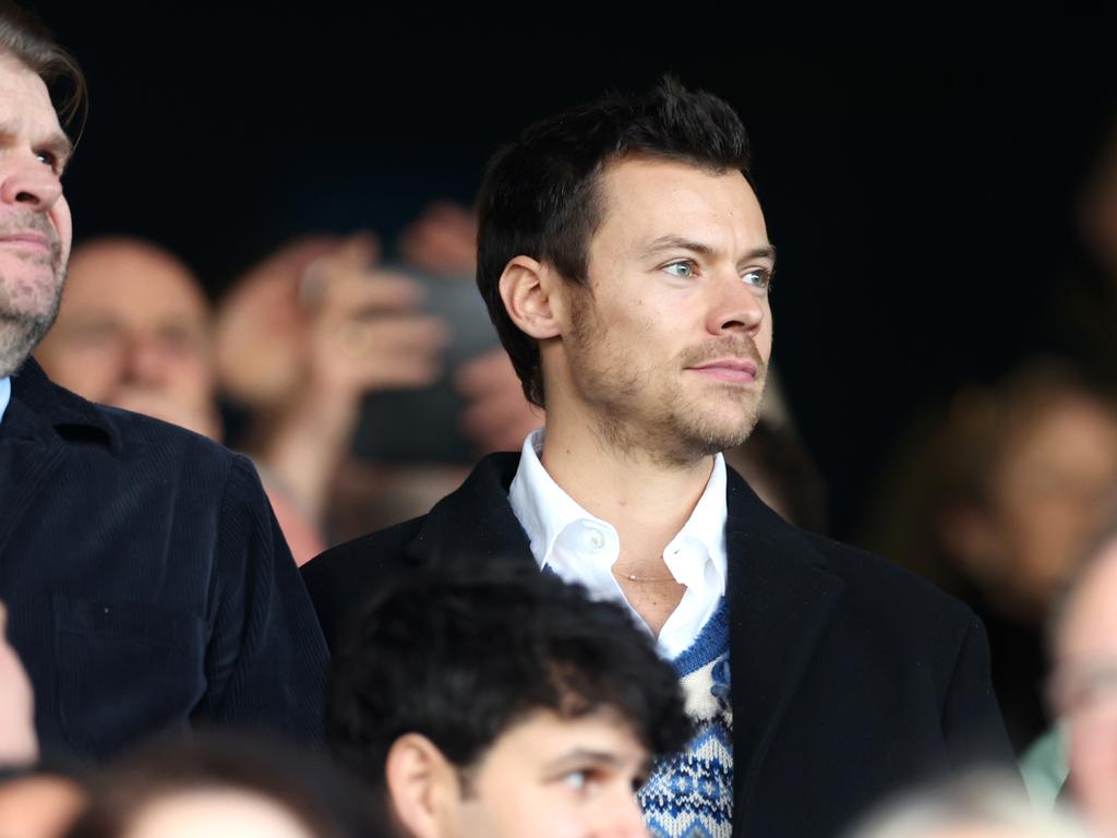 The singer wore his signature knitted sweater to the game. Picture: Catherine Ivill/Getty Images