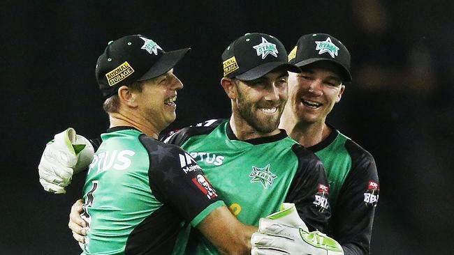 Glenn Maxwell is mobbed bt Stars teammates Evan Gulbis and Peter Handscomb after his stunning catch. Picture: Getty Images