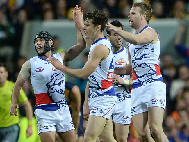 Caleb Daniel, Josh Dunkley, Tory Dickson and Jake Stringer celebrate a goal. Picture: Daniel Wilkins