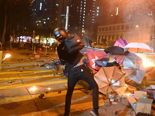 A protester throws a petrol bomb during clashes with police in Hong Kong. Picture: AFP