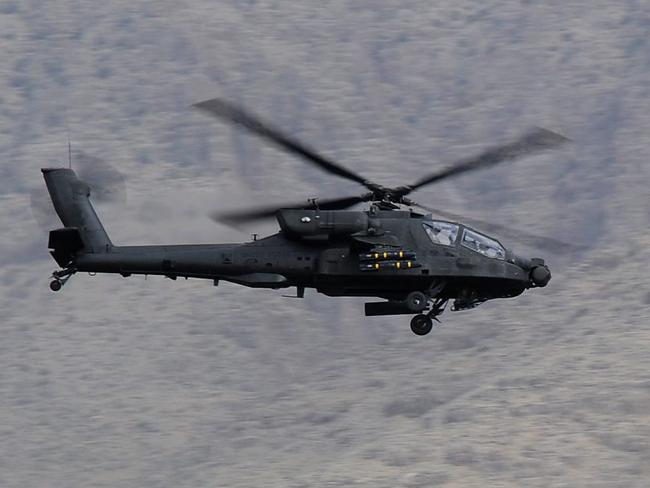 A U.S. Army Apache assault helicopter on patrol in the Char Chineh Valley of Uruzgan province, Afghanistan.Mid Caption: Soldiers from the 4th Brigade Afghan National Army (ANA) and Mentoring Task Force � Four (MTF-4) continue to make progress in Uruzgan province with the completion of Operation Hamkari Gogai Jangee II (return of the wolf) in the Char Chineh Valley. MTF-4 supported the push for ANA to independently carry out their own operations in the region.Photo by Sergeant Mick DavisJoint Task Force 633