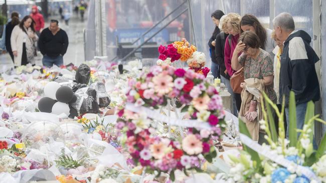 Tributes flow in the corso opposite Westfield shopping centre in Bondi Junction a week after 40 year old Joel Cauchi stabbed and killed six people and wounded many others before being shot dead by police. Picture: NCA NewsWire / Jeremy Piper