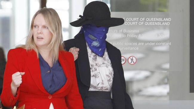 Heath (right, face covered) was supported by her legal counsel after the sentencing at Brisbane Supreme Court on Monday. Picture: NCA NewsWire/Tertius Pickard