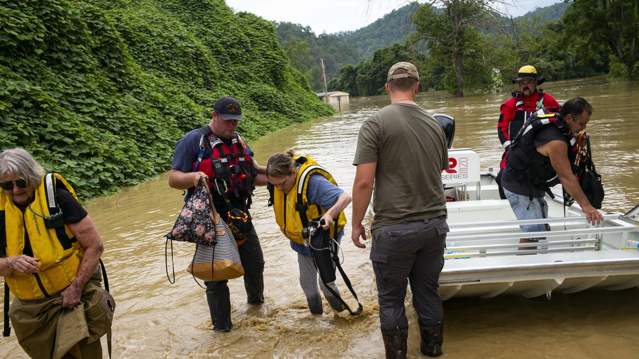 A rescue team helps a family out of a boat stuck in Quicksand, Kentucky. Picture: AFP