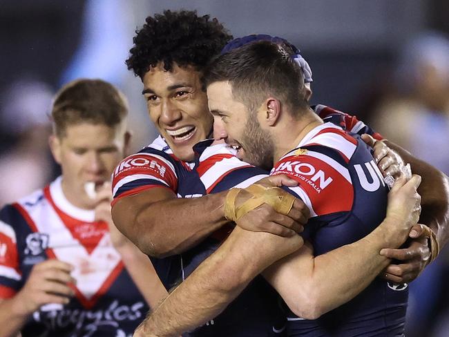 SYDNEY, AUSTRALIA - SEPTEMBER 09:  James Tedesco, Luke Keary and Siua Wong of the Roosters celebrate winning the NRL Elimination Final match between Cronulla Sharks and Sydney Roosters at PointsBet Stadium on September 09, 2023 in Sydney, Australia. (Photo by Mark Metcalfe/Getty Images)