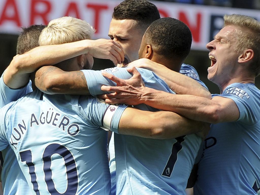 Manchester City's players celebrate a goal of Phill Foden, against Tottenham during the English Premier League soccer match between Manchester City and Tottenham Hotspur at Etihad stadium in Manchester, England, Saturday, April 20, 2019. (AP Photo/Rui Vieira)