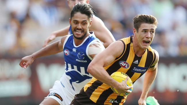 Hawthorn’s James Cousins charges past Aaron Hall. Picture: Michael Klein