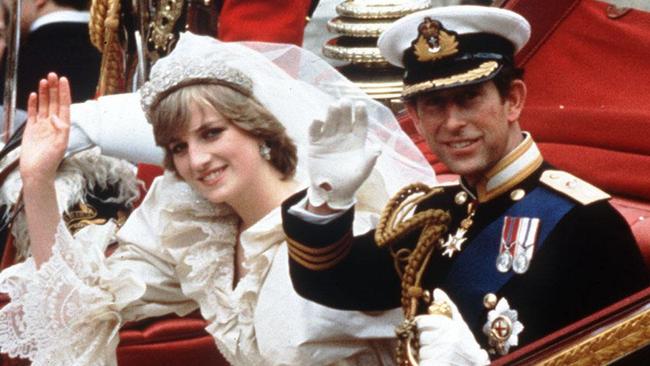 The Princess and Prince of Wales, Diana and Charles, wave from their carriage on their wedding day, in 1981.