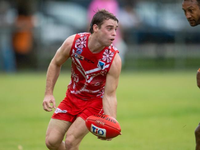 James Edmonds with a look to handball for Waratah against Wanderers. Picture: Che Chorley