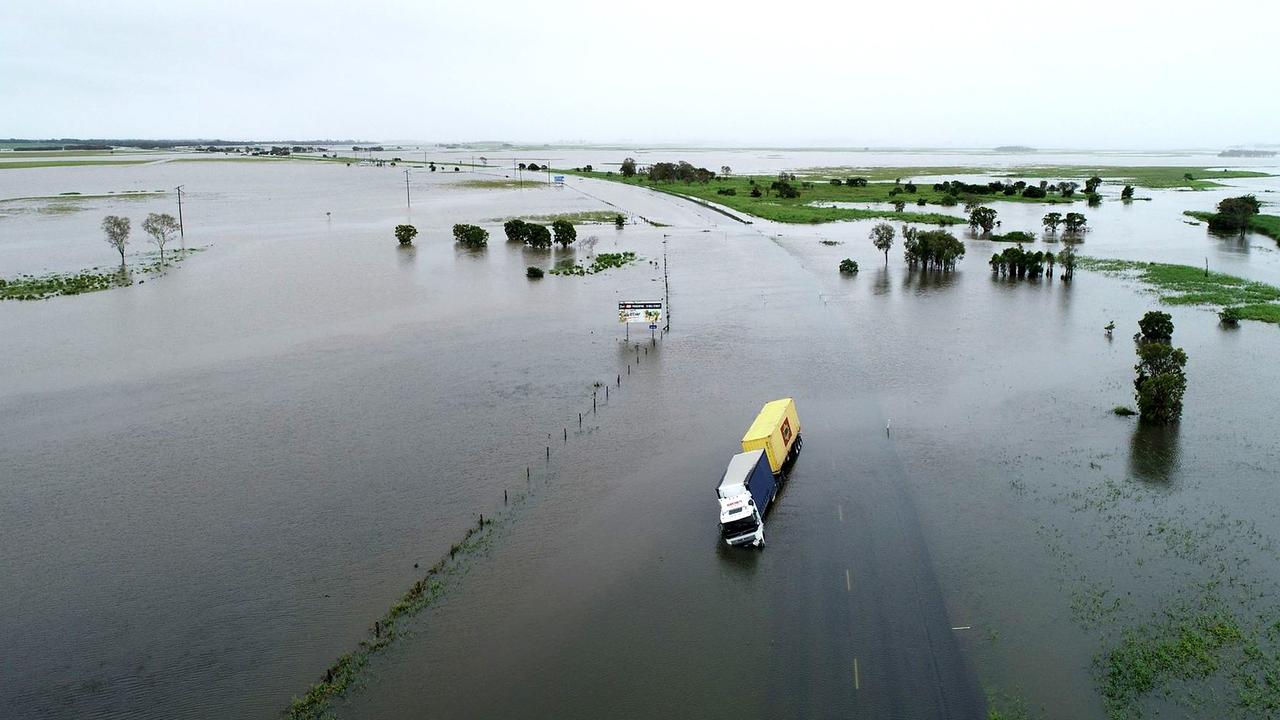 Drone images of flooding at Thompson's Creek on the Bruce Highway looking north, where a truck driver had tried his luck and failed. Photos: Robert Murolo