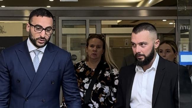 Adam Darwich, right, leaving NSW District Court with high-profile lawyer Ahmed Dib last Friday.