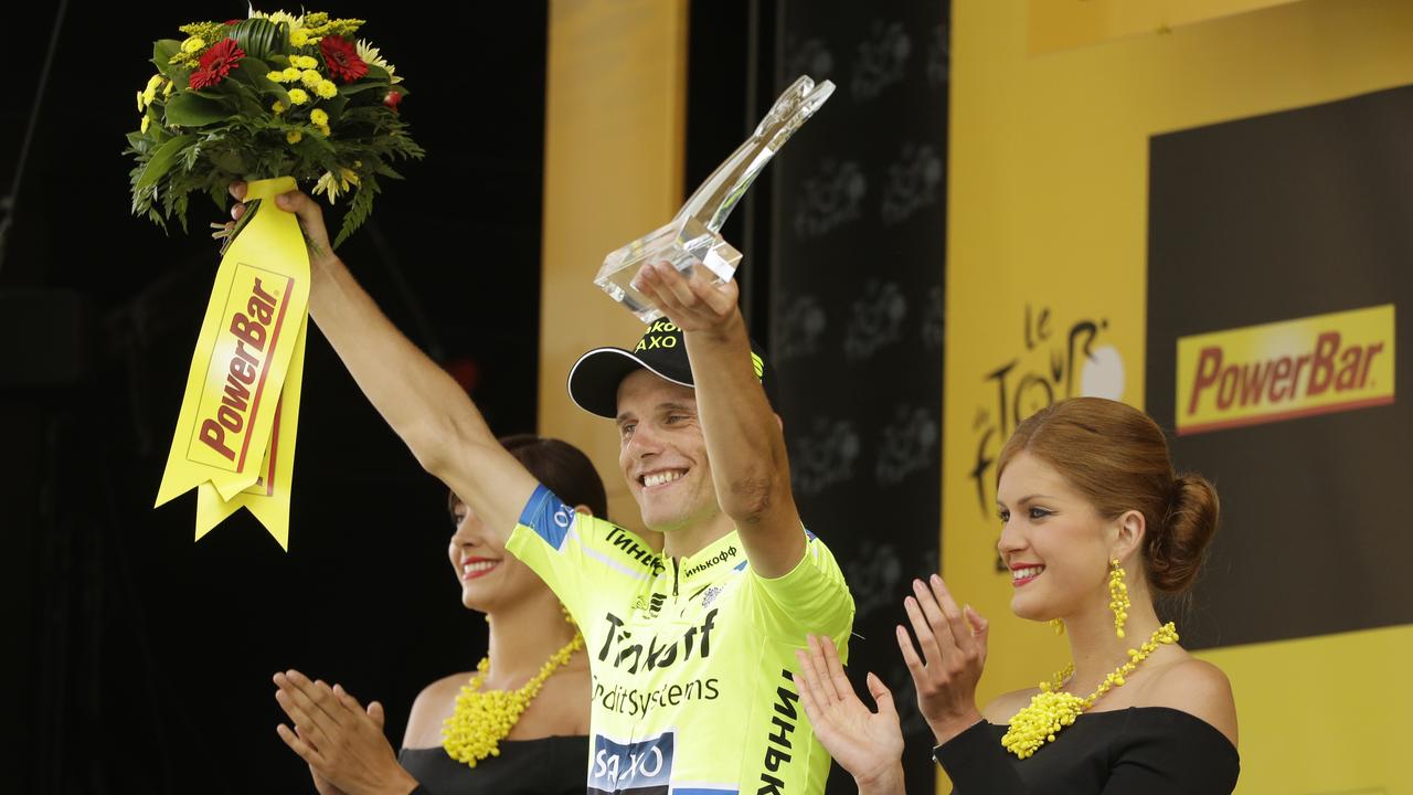 Stage winner Poland's Rafal Majka celebrates on the podium of the seventeenth stage of the Tour de France cycling race over 124.5 kilometers (77.4 miles) with start in Saint-Gaudens and finish in Saint-Lary, France, Wednesday, July 23, 2014. (AP Photo/Laurent Cipriani)