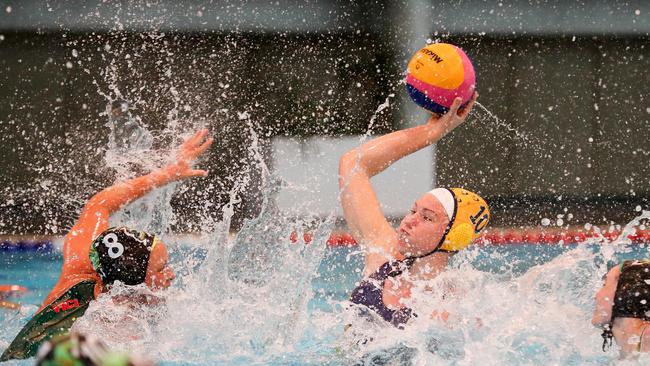 Tilly Kearns (no. 10, yellow cap) in action for the Sydney Uni team at Pymble Ladies College. Picture: Ryan Osland