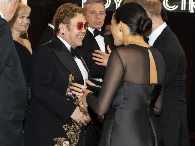 Elton John, left, is among their inner circle. Picture: Getty Images