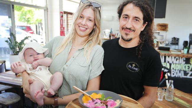 Grounded in Miami owners Natasha Kasper and Zeus Stellas with their daughter Aurelia at the new cafe. Picture: Glenn Hampson