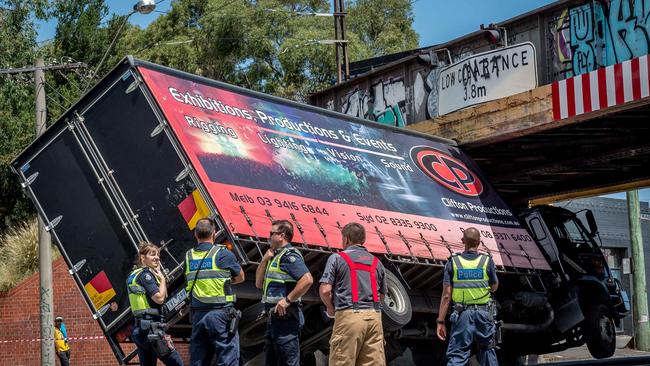 The truck has become wedged under the rail bridge near Market Street. Picture: Jake Nowakowski