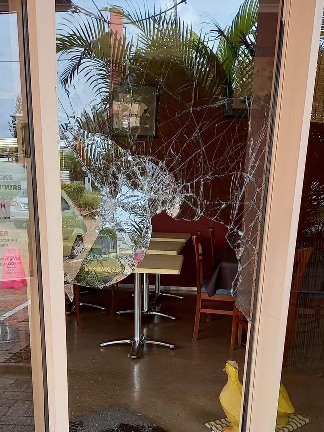 Thieves and vandals have smashed the storefronts of businesses across Hervey Bay. The scene at Two Ducks Cafe in Urangan after it was targeted.