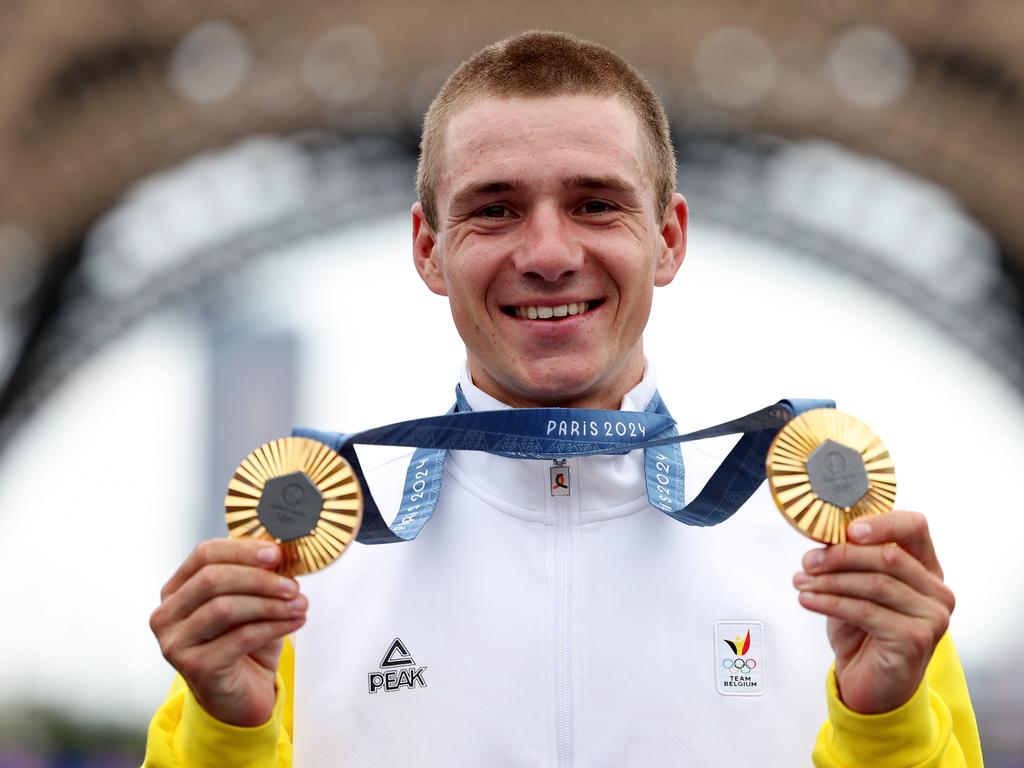 Gold medalist Remco Evenepoel of Team Belgium poses on the podium.