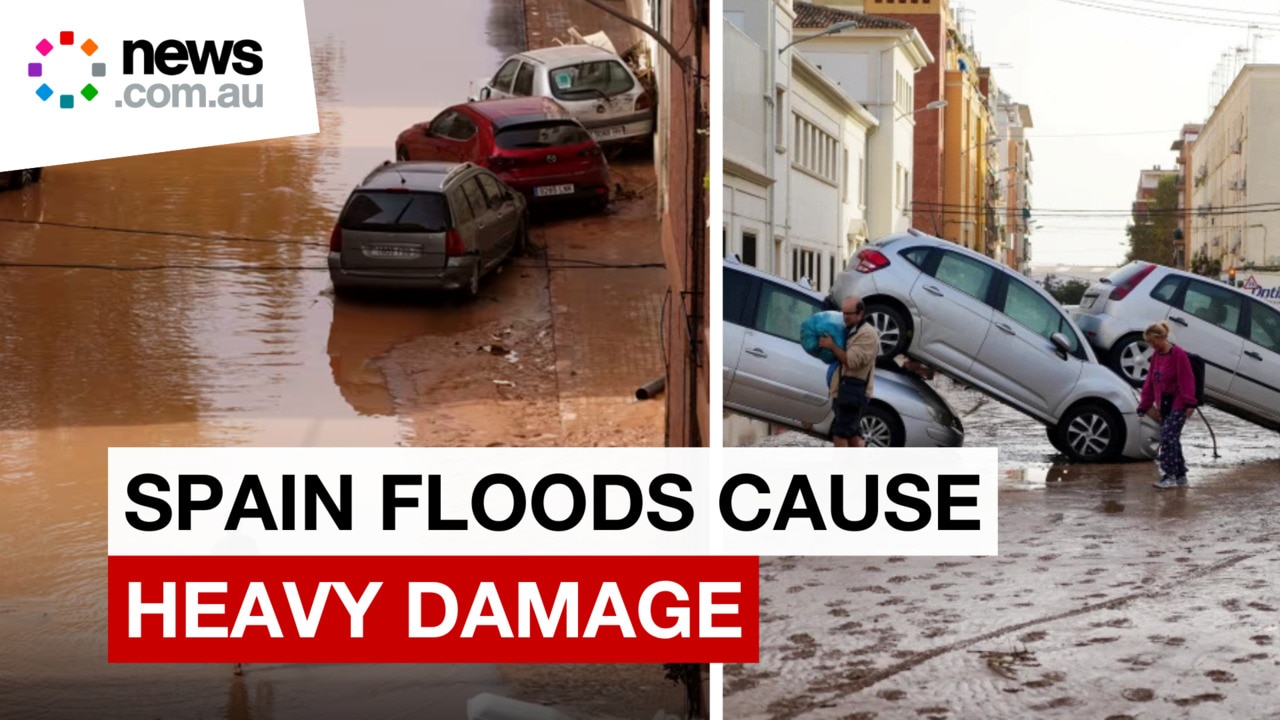 Firefighters search vehicle wreckage after Spain floods