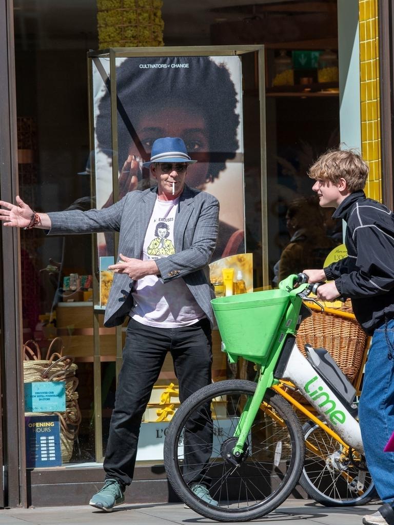 The Aussie star was bizarrely directing cyclists on a footpath. Picture: Backgrid