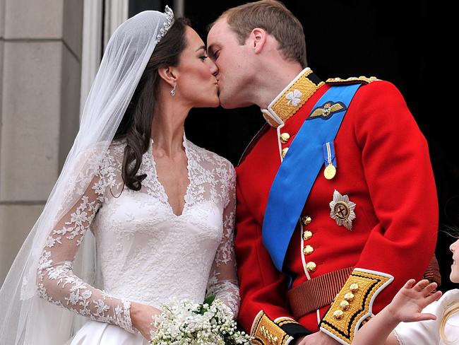 Prince William and his wife Kate, Duchess of Cambridge, kiss on the balcony of Buckingham Palace. Picture: AP