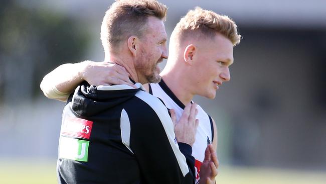 Nathan Buckley gets a hug from Adam Treloar. Picture: Michael Klein