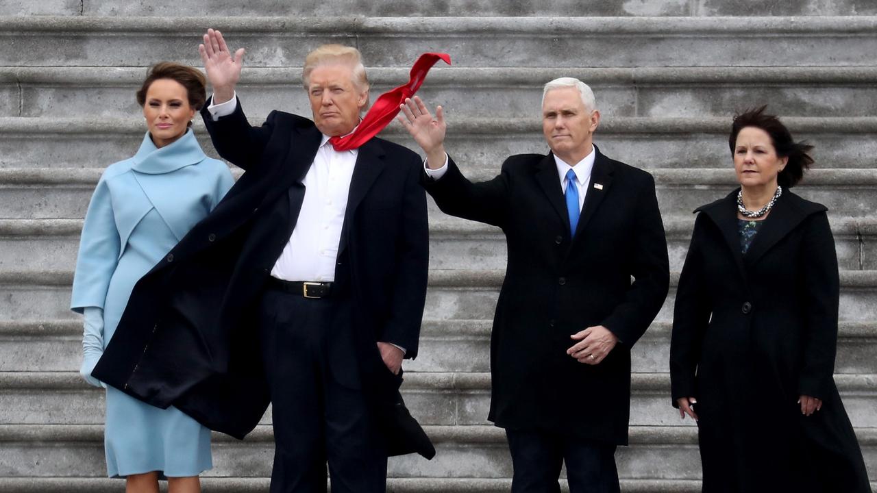 First Lady Melania Trump, President Donald Trump, Vice President Mike Pence and Karen Pence wave goodbye to Barack and Michelle Obama on the West Front of the US Capitol. Picture: Getty