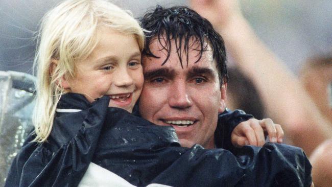 Greg Phillips and Erin after he won the 1992 SANFL grand final with Port Adelaide against Glenelg at the former Football Park. Picture: Neon Martin