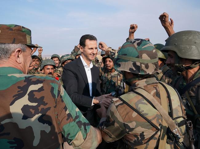 President Bashar al-Assad with government troops. Picture: Facebook