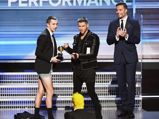 Nick Jonas presents the the Best Pop Duo/Group Performance award for ‘Stressed Out’ to recording artist Tyler Joseph of music group Twenty One Pilots onstage during The 59th GRAMMY Awards at STAPLES Center on February 12, 2017 in Los Angeles, California. Picture: Getty