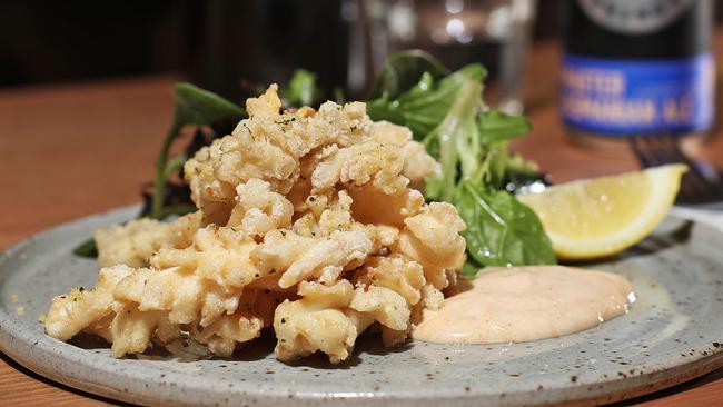 TAS WEEKEND: Indulge, Wattlebank, Richmond: Salt and pepper calamari. Served with dressed leaves, paprika mayo and lemon. Picture: LUKE BOWDEN