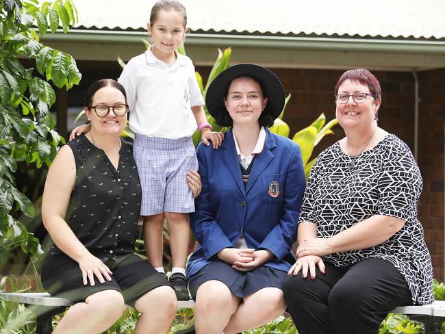 Renae and Quinn Malos, 6, with Jade Glasson, 16, and her mother Bronwyn Venus at Cannon Hill Anglican College. Picture: AAP/Claudia Baxter