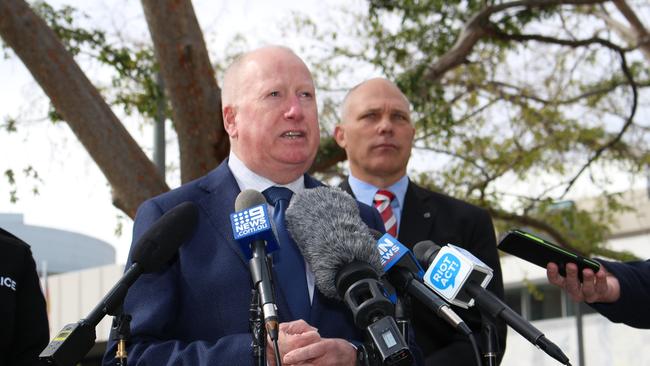 ACT Police minister Mick Gentleman speaks with the media.