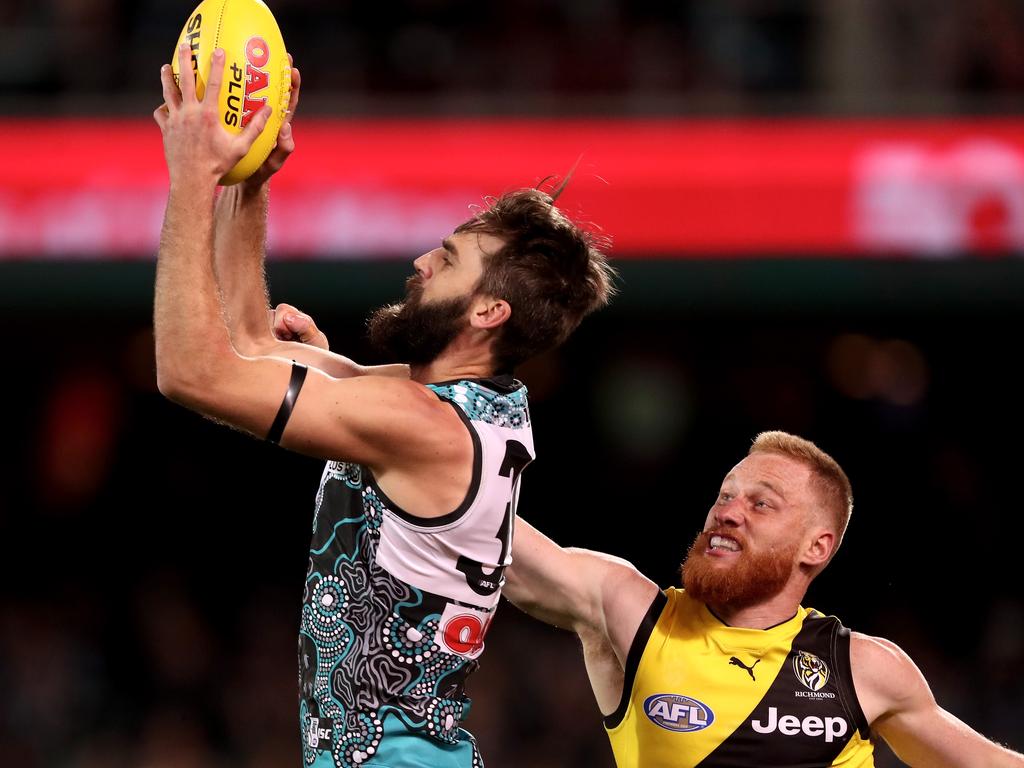 ADELAIDE, AUSTRALIA - JUNE 08: Justin Westhoff of the Power marks in front of Nick Vlastuin of the Tigers during the 2018 AFL round 12 match between the Port Adelaide Power and the Richmond Tigers at Adelaide Oval on June 08, 2018 in Adelaide, Australia. (Photo by James Elsby/AFL Media/Getty Images)