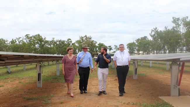 Bishop Michael McCarthy, Jack Hooper from GEM Energy and Shalom College principal Dan McMahon at the school's solar farm.