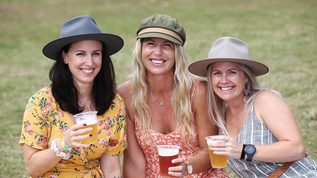 Jasmina Michetti, Ellinor Altzar and Kellie Hampton of the northern beaches relax with a cold beer in Rex Smeal Park to the tunes of Seachange. The local acoustic duo opened the Plantation Picnic in the Park, the final event of the 2021 Port Douglas Carnivale. Picture: Brendan Radke