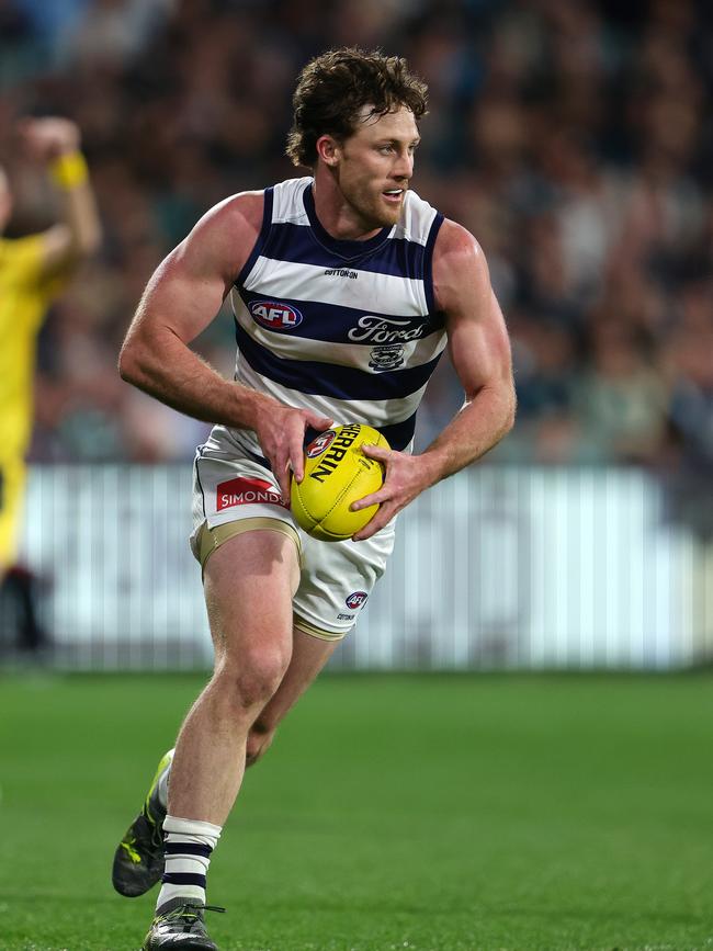 Jed Bews takes off from defence during the Cats’ second qualifying final win against Port Adelaide. Picture: Sarah Reed/AFL Photos via Getty Images