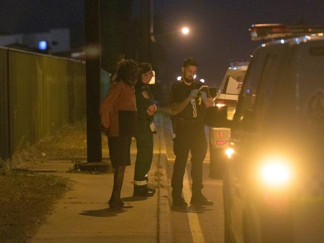 Police outside an industrial complex where a person was shot by a gunman in the suburb of Woolner in Darwin. Picture: AAP