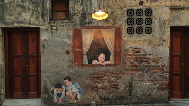 Murals vividly depict the daily lives of Chinese residents during the 1960s, including the Little Girl Peering Out of the Window. Picture: Javier Chor (supplied).