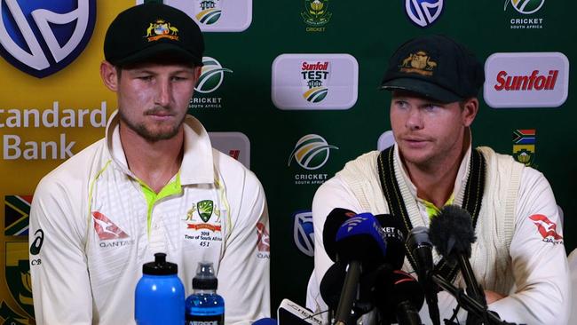 Cameron Bancroft (left) and Steve Smith speak to the media after the Australian team’s ball tampering against South Africa was revealed. Picture: AFP