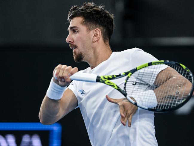 ADELAIDE, AUSTRALIA - JANUARY 08: Thanasi Kokkinakis of Australia  plays  a forehand   in his match against  Tomas Martin Etcheverry of Argentina during day three of the 2025 Adelaide International at Memorial Drive on January 08, 2025 in Adelaide, Australia. (Photo by Mark Brake/Getty Images)