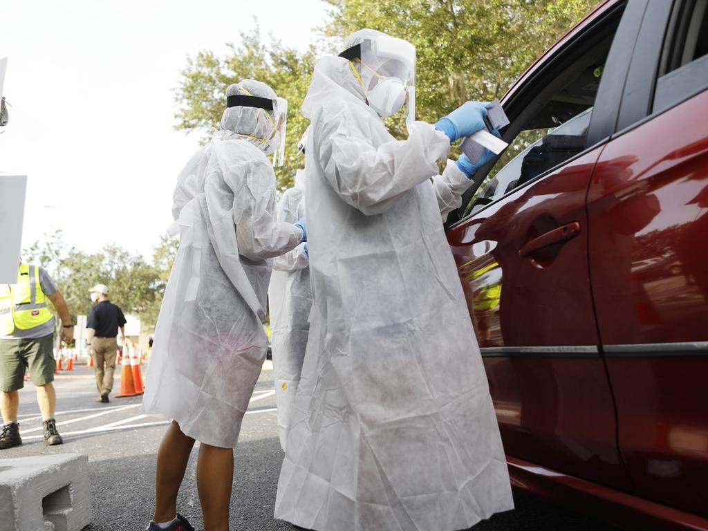 University of South Florida health workers administer coronavirus testing in Tampa, which is running out of ICU beds. Picture: Octavio Jones/Getty