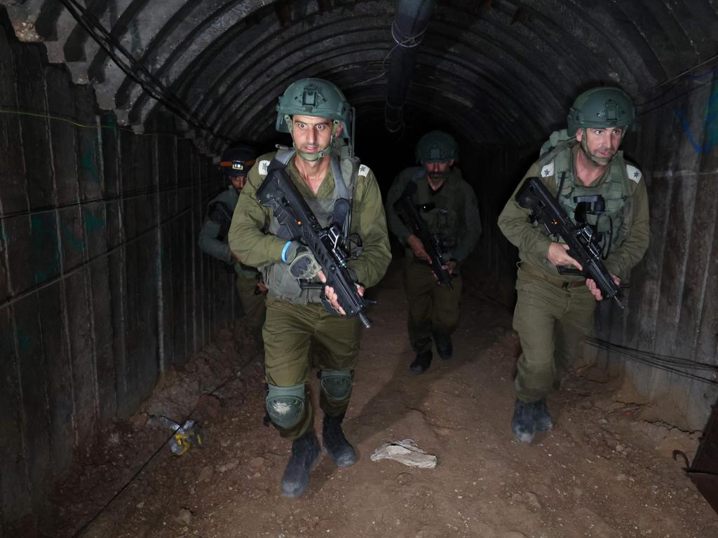 Israeli soldiers visit a tunnel that Hamas reportedly used to attack Israel through the Erez border crossing on October 7. Picture: AFP