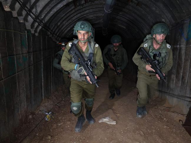 Israeli soldiers visit a tunnel that Hamas reportedly used to attack Israel through the Erez border crossing on October 7. Picture: AFP