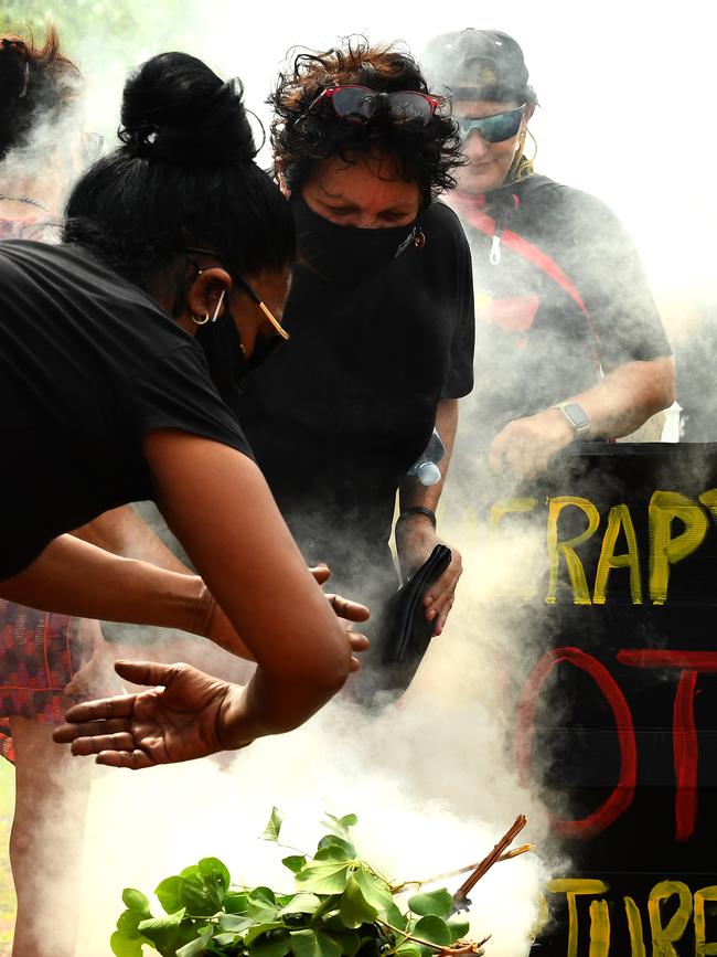 Protesters at a smoking ceremony outside Don Dale. Picture: (A)manda Parkinson