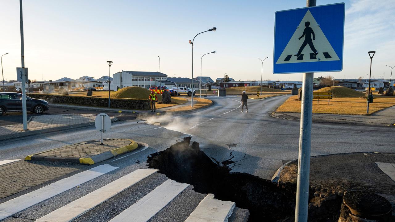 A crack cutting across the main road in Grindavik on Monday following hundreds of earthquakes. Picture: Kjartan Torbjoernsson / AFP